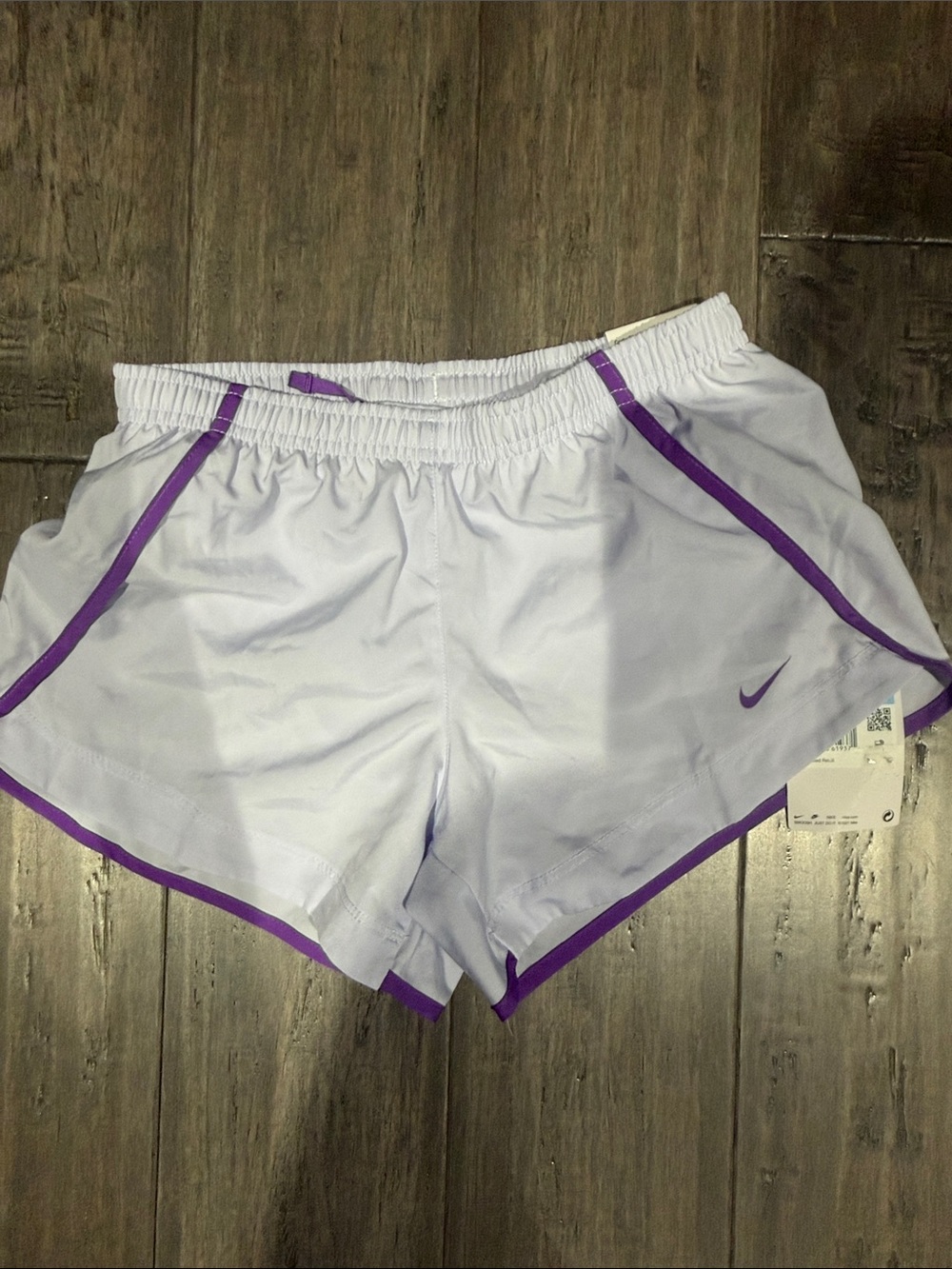 Nike Women's White Athletic Shorts with Purple Trim